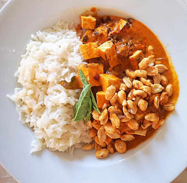 bowl of curry with peanuts