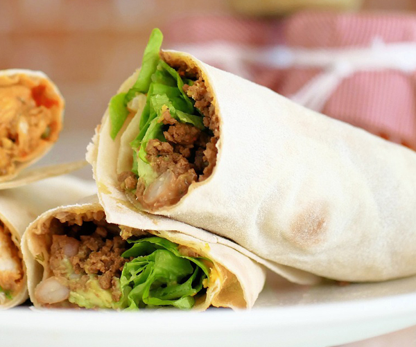 2 burritos with burger and lettuce