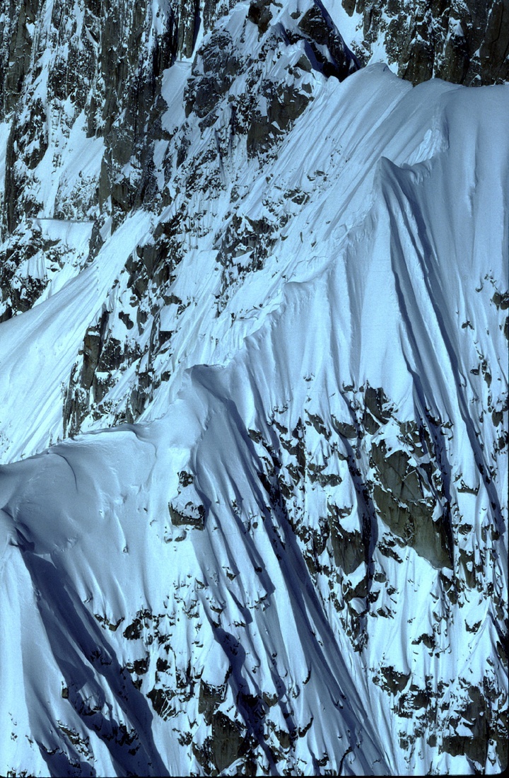 Mountain side with snow aerial in alaska 