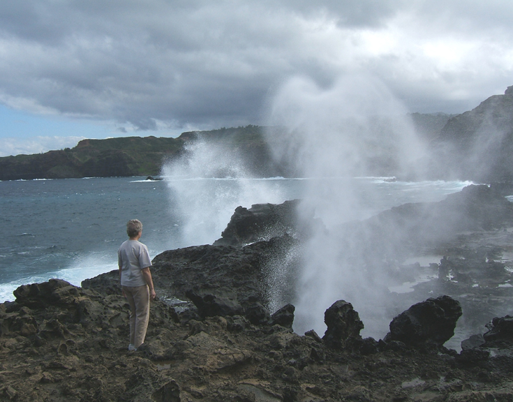 person standing close to Nakalele blowhole on maui