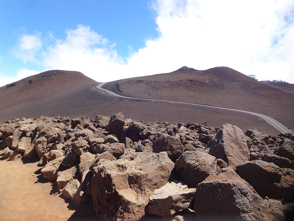 blus sky boulders and road leading to top of haleakala