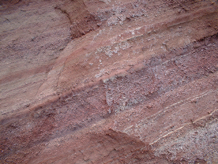 red and orange striped rock wall at koki beach