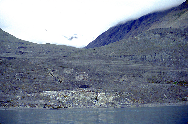 Tiny Tent on barren land recently deglaciated by Muir glacier