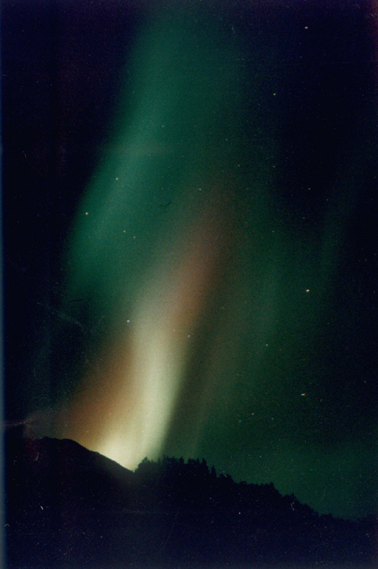 northern lights green red yellow from land to sky