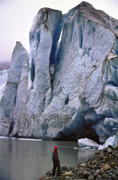 people by iceberg and glacier in alaska